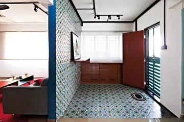 Peranakan Tiles line the walls and floors of an entryway in a HDB. Interior design by Free Space Intent