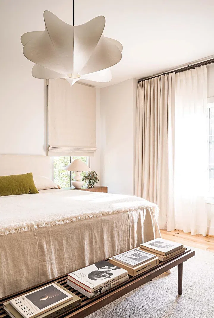 The master bedroom features a custom bed by Design Industry and West Elm light fixture.
