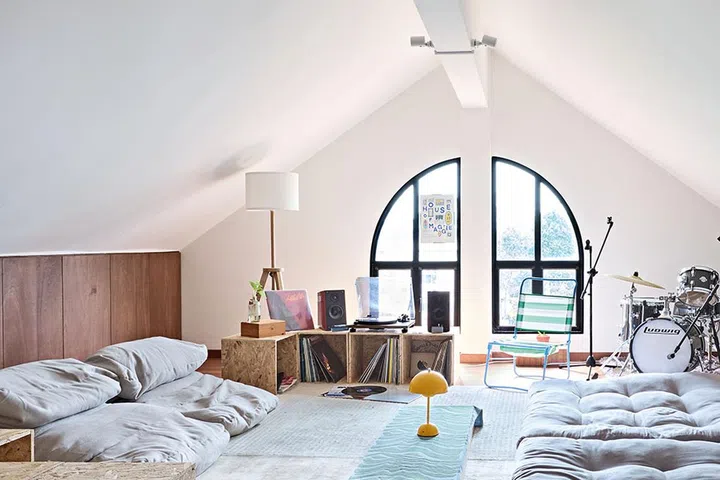 The attic was formerly a dark storage space, but Natalie transformed it into a lively and bright hangout spot.