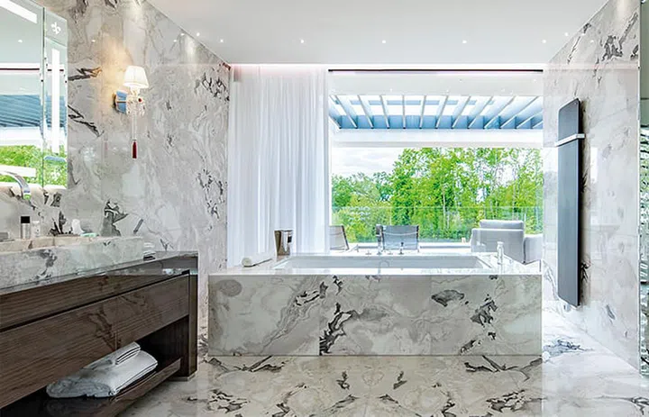 Hotel bathroom and bathtub in Ultima Geneva Grand Villa