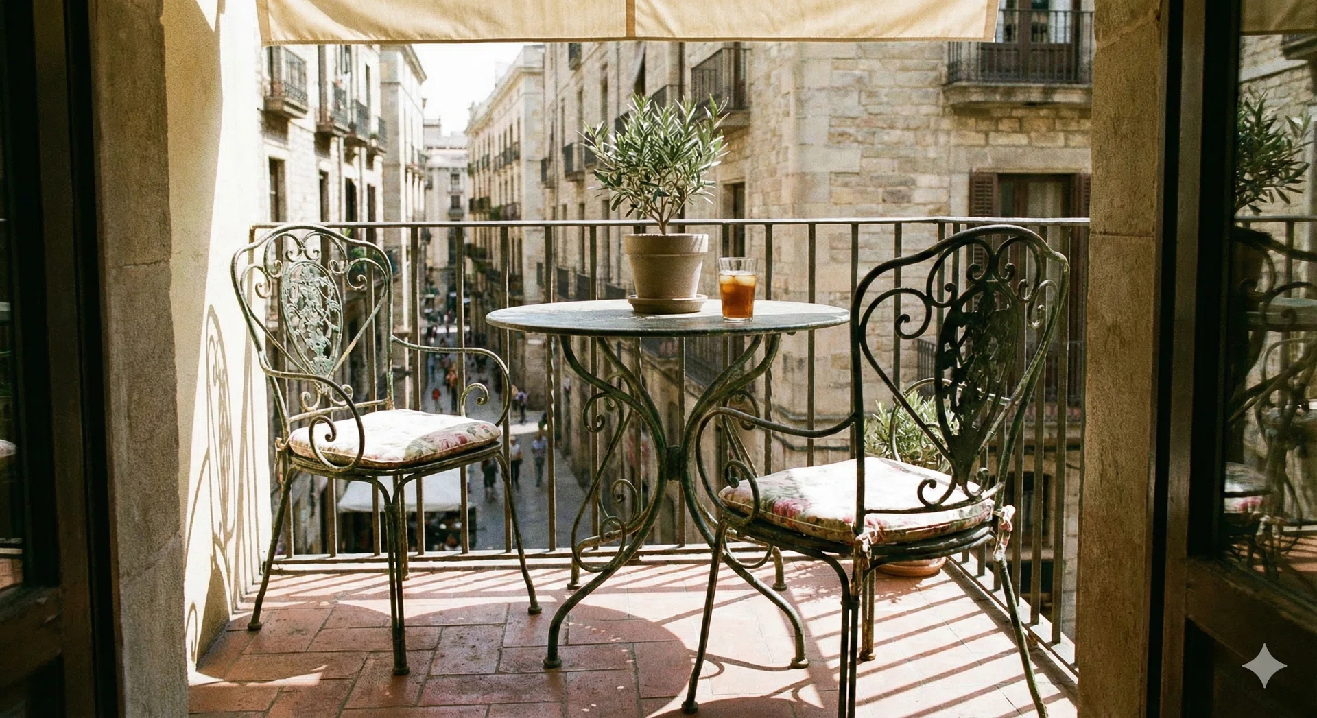 An mage of metal outdoor chairs and tables in a balcony.