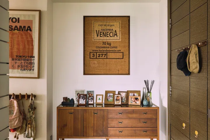 In the entrance foyer, a framed coffee sack that they brought home from a coffee finca in Columbia.