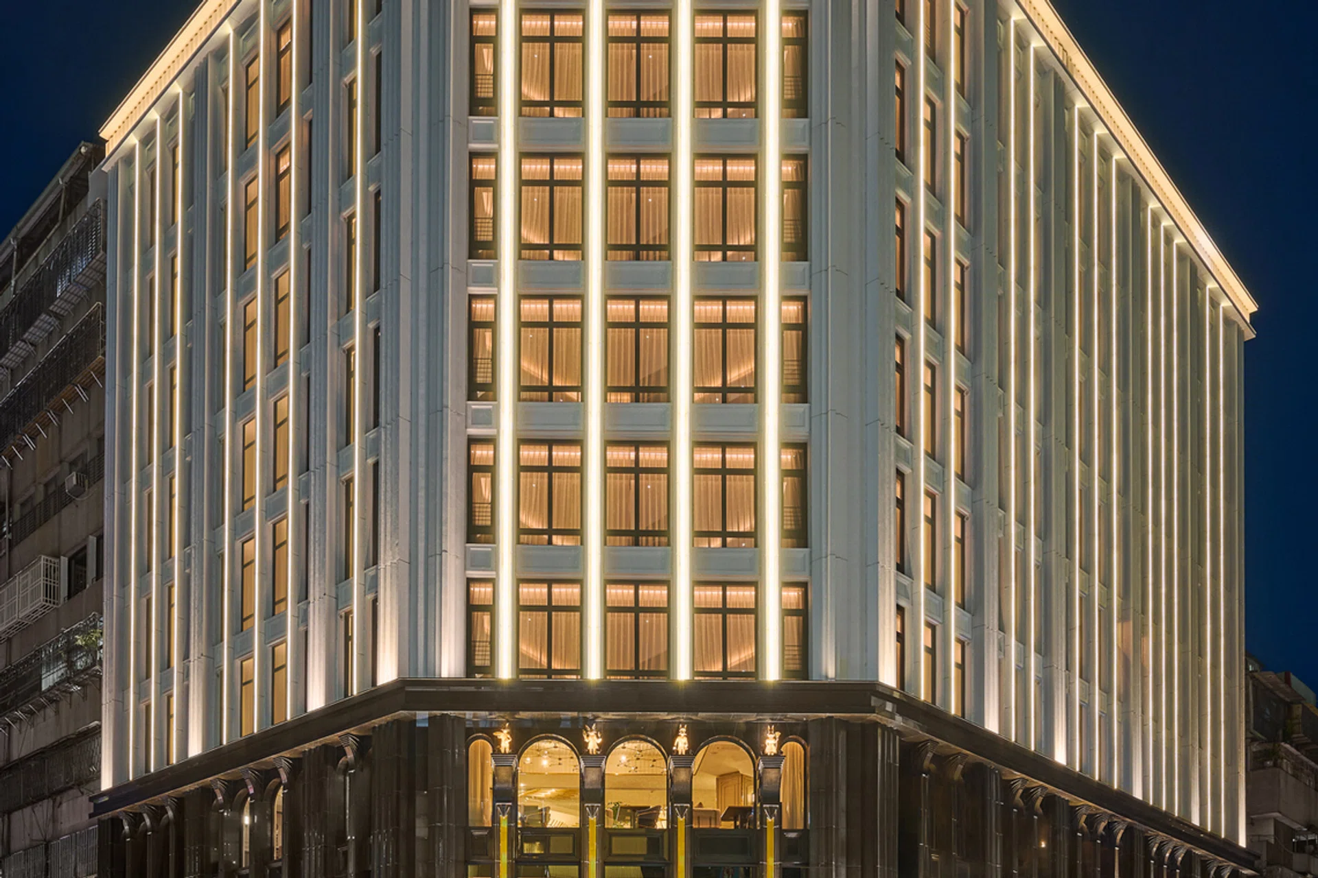Night time facade of the OKU Hotel Taichung, a revitalised former Sakurada Department Store decked in French Art Deco elegance.