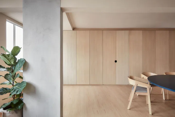 With the existing walls separating the two bedrooms and the living and dining rooms demolished, what used to be compartmentalised spaces now form one large, multi-purpose, living area.