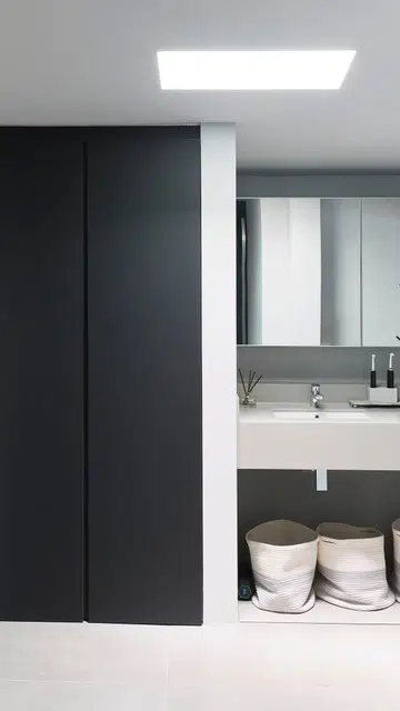 Skylights were installed in the bathrooms in this 1,189 sq ft single-storey corner terrace house in Siglap.