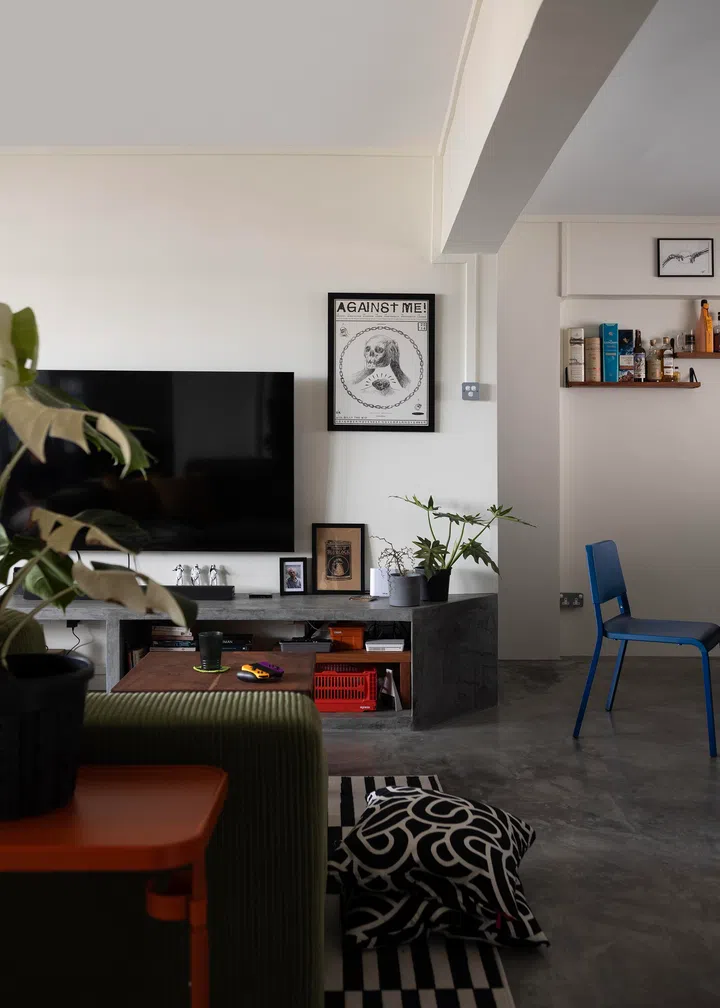 An angled TV console serves as centre piece for this living room.