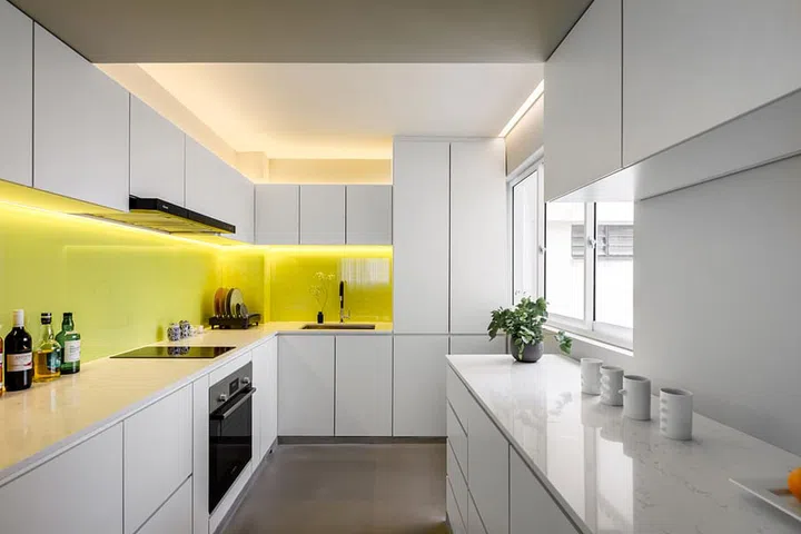 Random pops of colour, such as a mustard cushion, and the yellow backsplash in the kitchen were all carefully orchestrated.