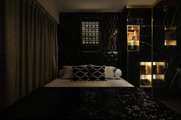 Dark modern luxury master bedroom with shelves for handbags in a banking couple's 3-bedroom condominium in West Coast.