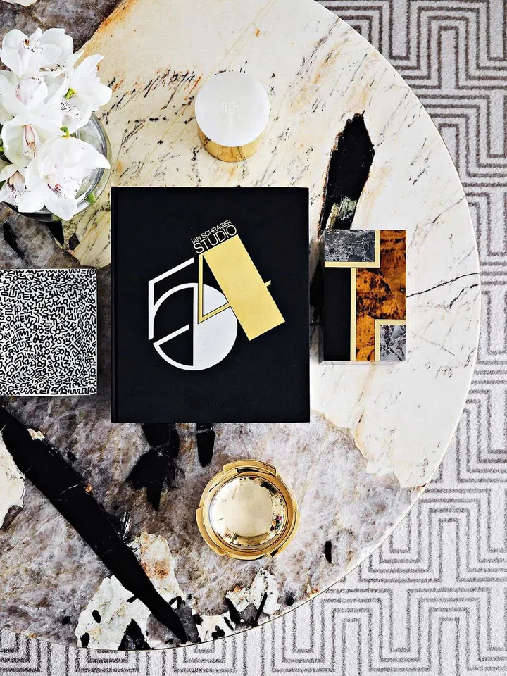 Greg designed the rug to match the rich details of the coffee table.