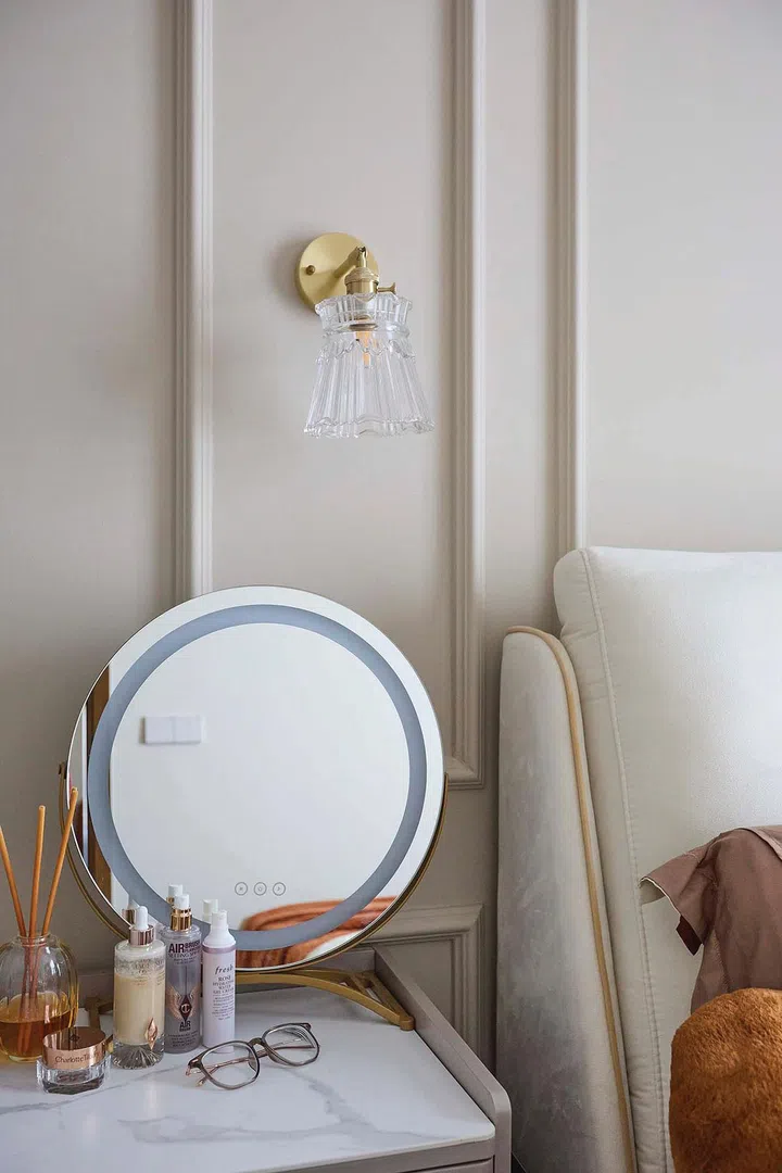 Vintage style glass pendant lamp adorn the wainscot bedside walls in interior designer Vivian Chen (of Muwu Construction) and financial advisor husband, Michael Chan's 635 sq ft 2-bedroom condominium along Stirling Road.