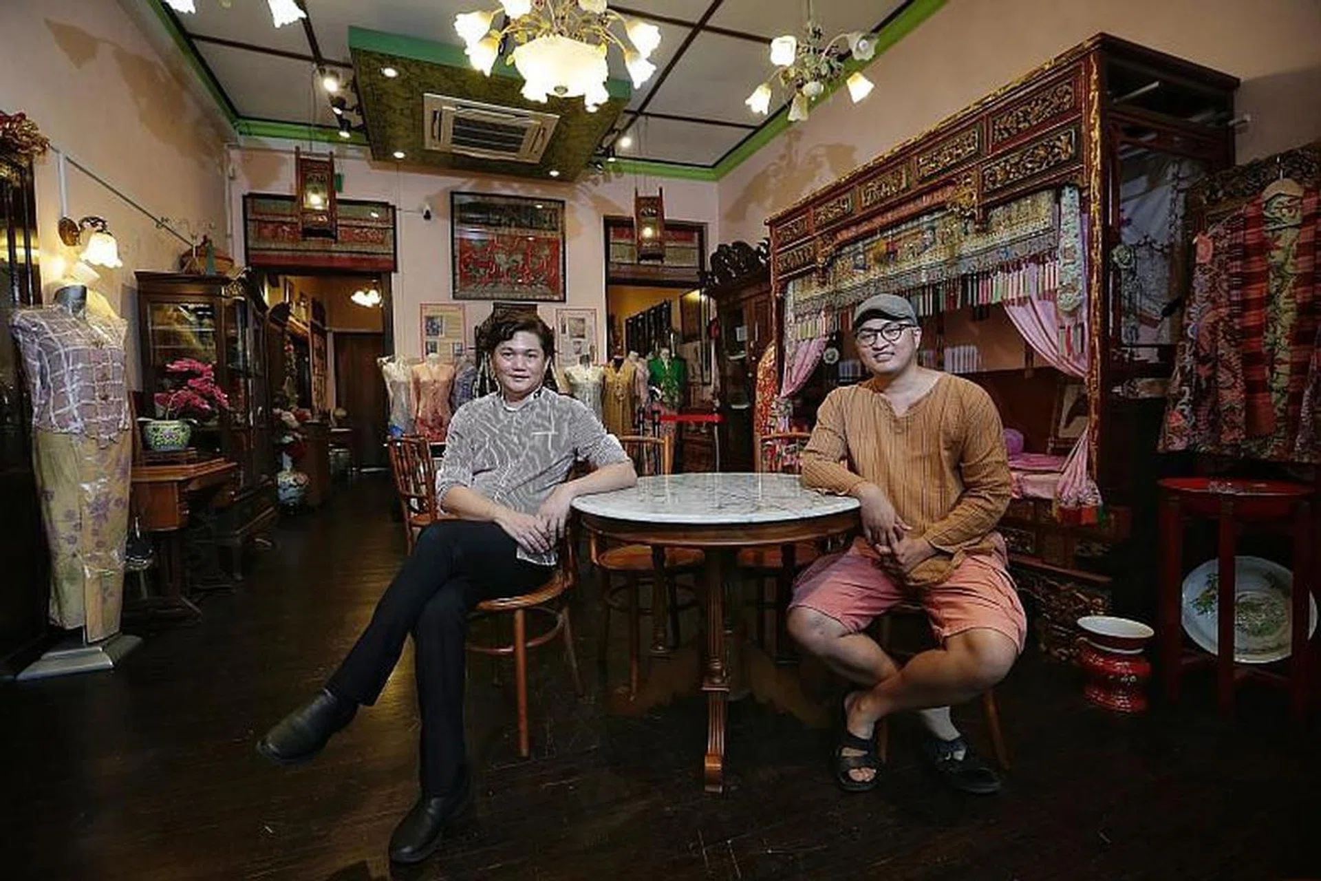 Brothers Raymond (left) and Edmond Wong at the Rumah Kim Choo shophouse in East Coast Road, which is filled with antiques and family heirlooms. PHOTOS: KEVIN LIM, OPUS