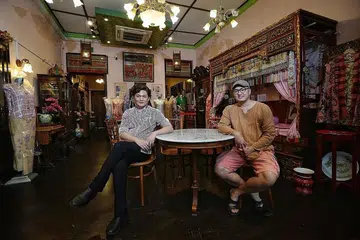 Brothers Raymond (left) and Edmond Wong at the Rumah Kim Choo shophouse in East Coast Road, which is filled with antiques and family heirlooms. PHOTOS: KEVIN LIM, OPUS