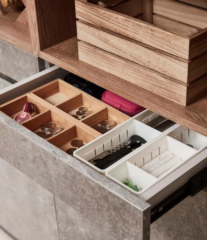 The cabinets above and drawers below can hold crockery and cutlery, which makes for easy retrieval when dining or hosting without having to crowd around the kitchen.