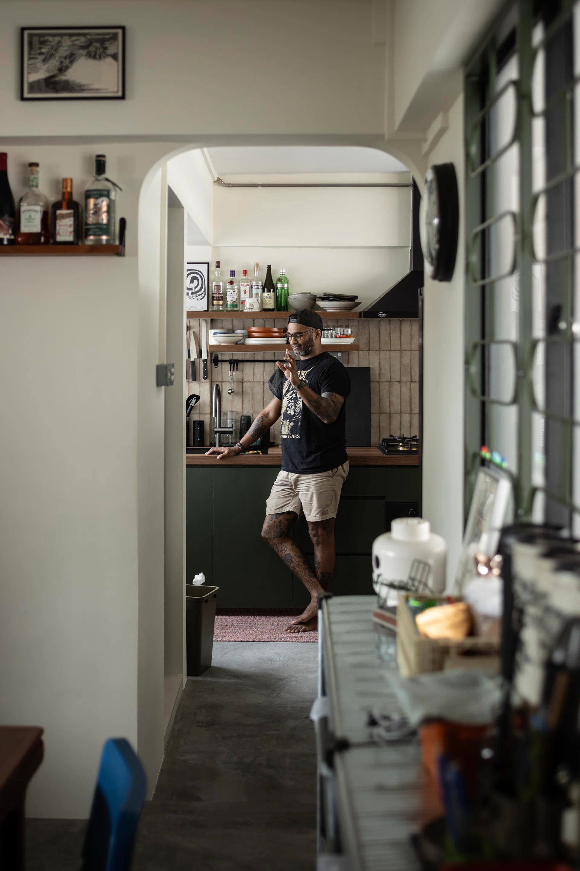 Homeowner poses for a photo in his 4-room HDB resale flat in the MacPherson neighbourhood.