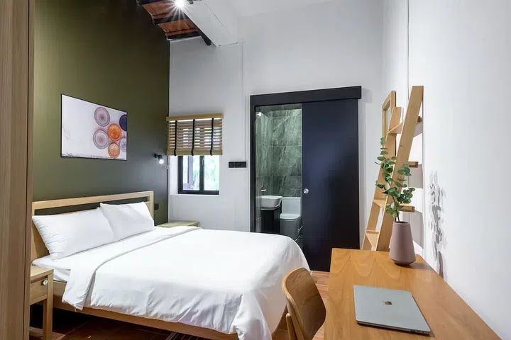 A private bedroom provided by Habyt at Emerald Hill in Orchard.