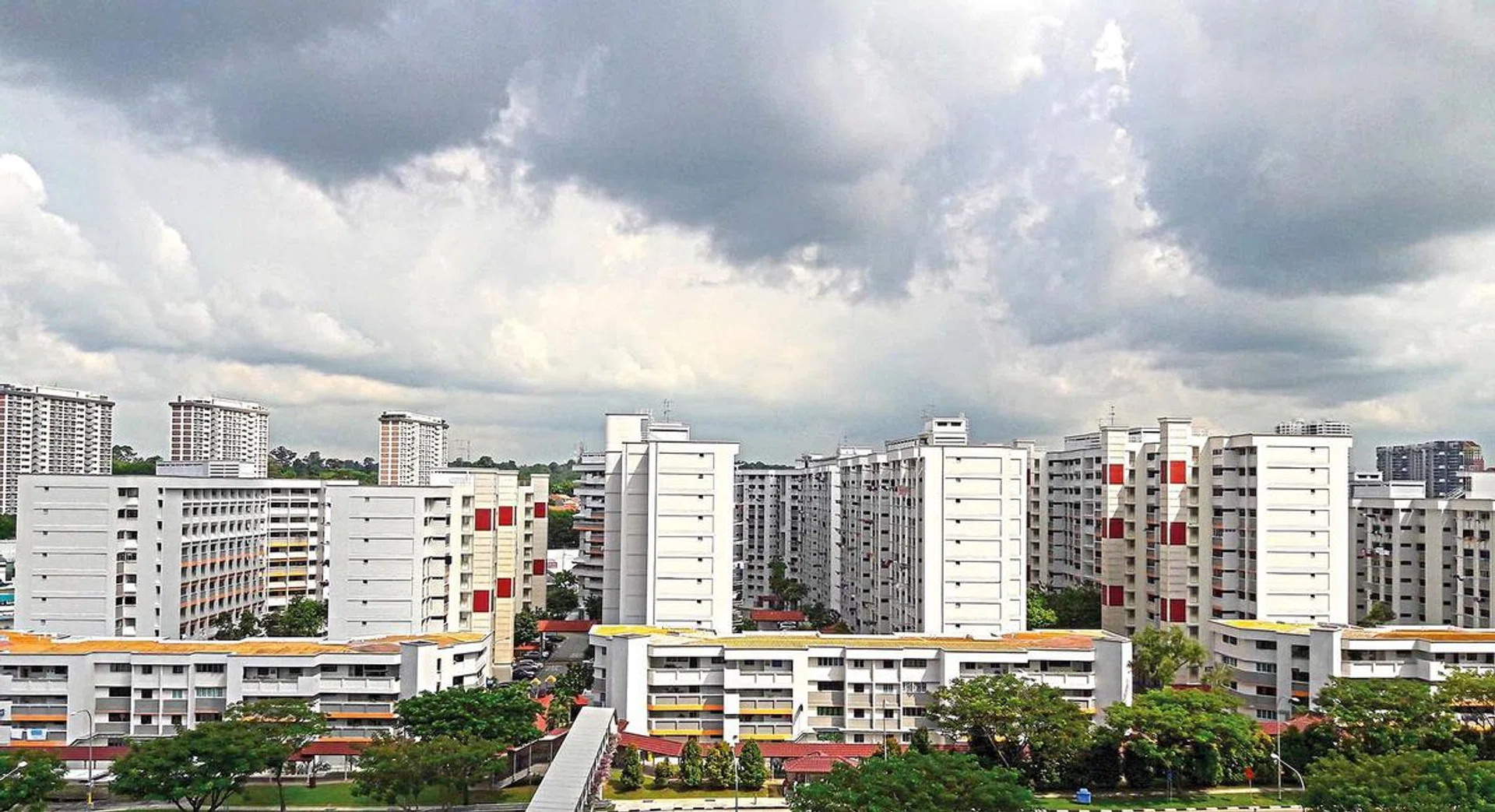 Aerial View of Singapore's HDB under cloudy blue sky