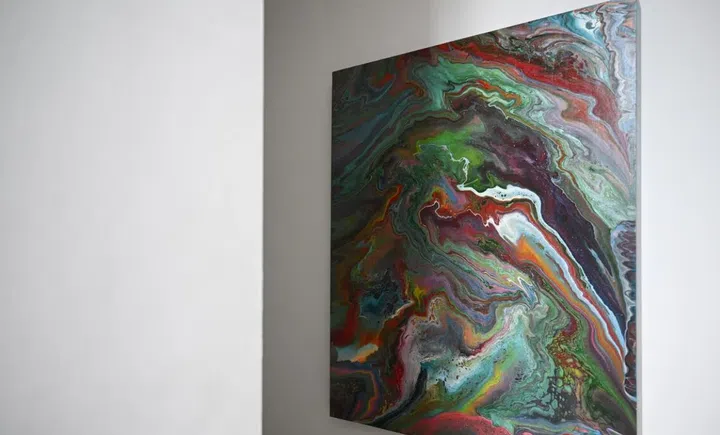 Cellini founder Tan Cheng Whatt’s home is filled with his artworks, such as this acrylic pour painting.