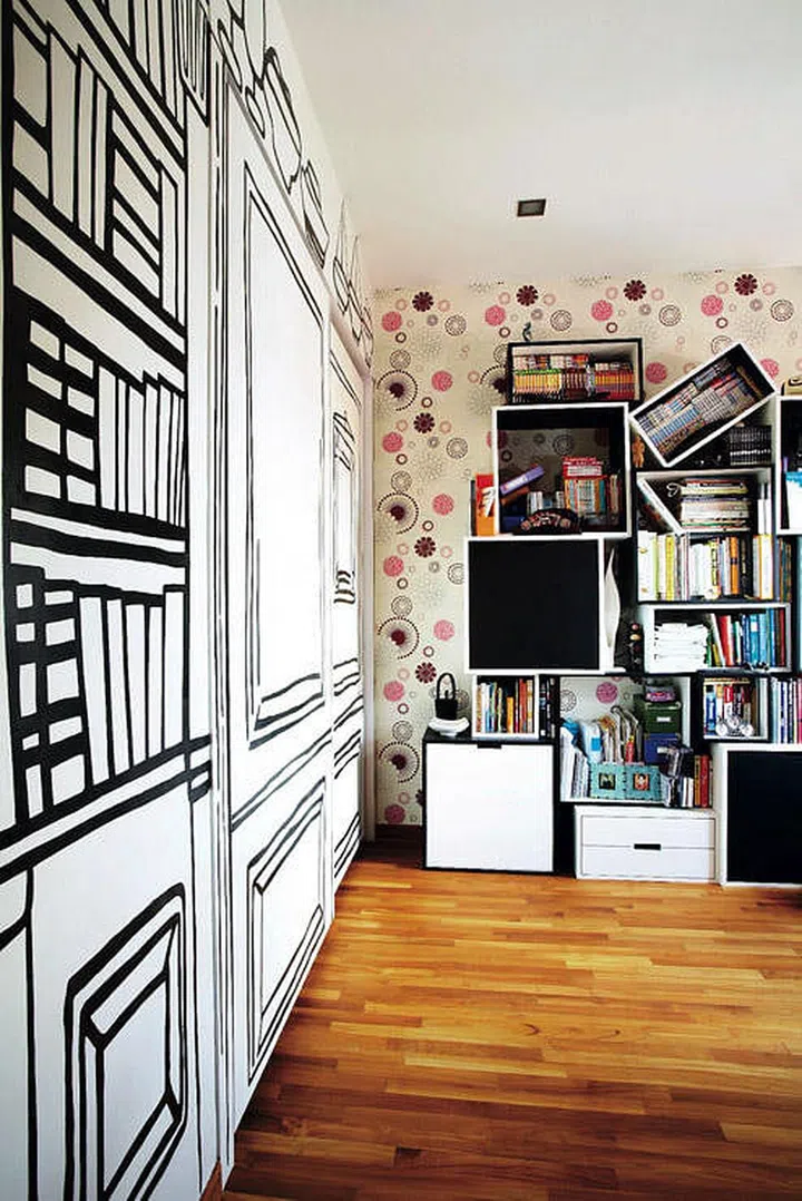 Custom wall murals designed by Museum Home’s in-house artist, Andre Tan, splashed all over the wardrobe doors and bookshelf wall in this 4-bedroom penthouse in Telok Kurau.