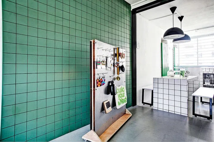 This mobile display board made with perforated metal and wood can be moved anywhere in the home. Interior design by Exquisite Art Furniture Decoration