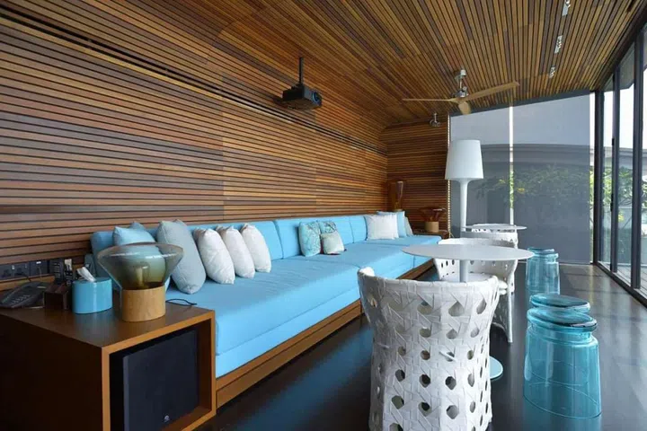 B&B Italia woven pattern chairs, the Pedrali Inox round tables, and Club 21 glass stools.