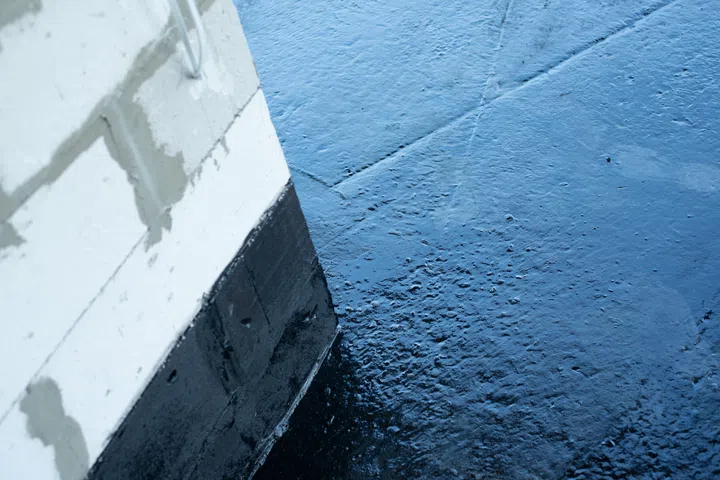 Floor covered with a layer of waterproofing mastic.