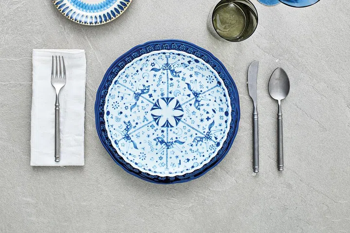 M-mode clasico Geometric dessert plate, $15.90; Blue dinner plate, $17.90; Wazan Japan carousel dinner plate,$45.90; Rustic matt cutlery, $7.90 each, all from Lovera Collections.