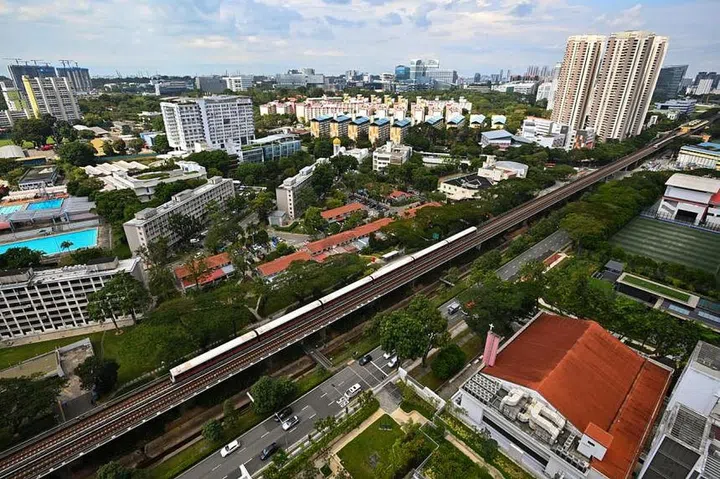 Aerial view of HDB flats and MRT track in Singapore
