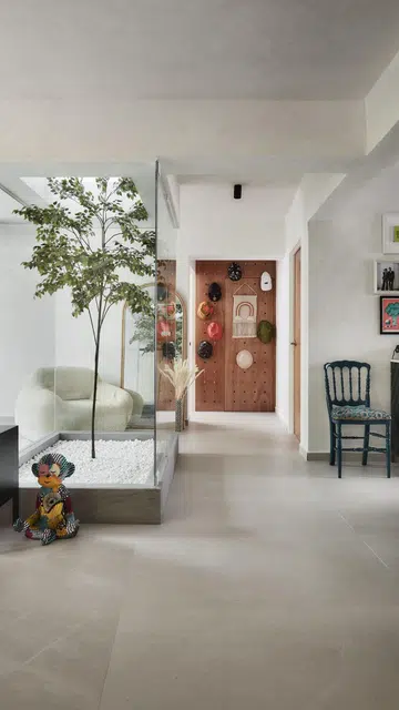 Glass encased skylight dominates the living area in this 1,367 sq ft 5-room HDB at Bedok Reservoir Road.