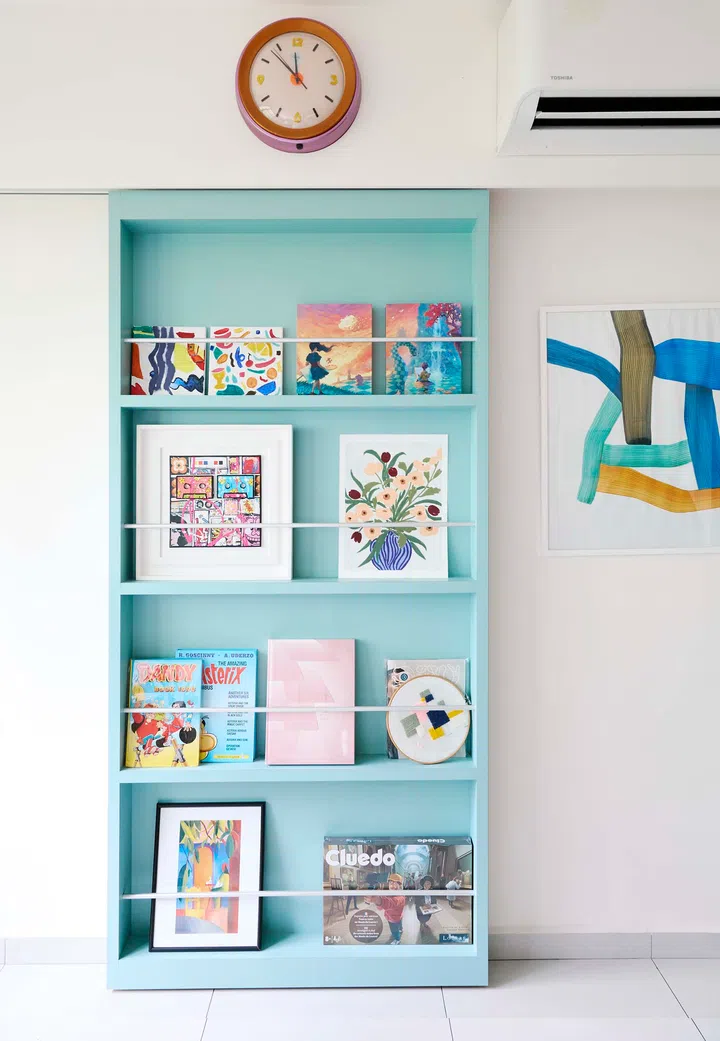 The hidden study door fully closed — cleverly disguised as a full-height magazine display rack.