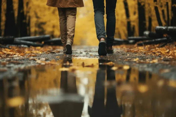Two people walking in the rain with umbrellas. Perfect for illustrating the beauty of a rainy day and the importance of companionship. Suitable for various projects, such as weather-related articles, friendship themes, or lifestyle blogs. Image from 123RF