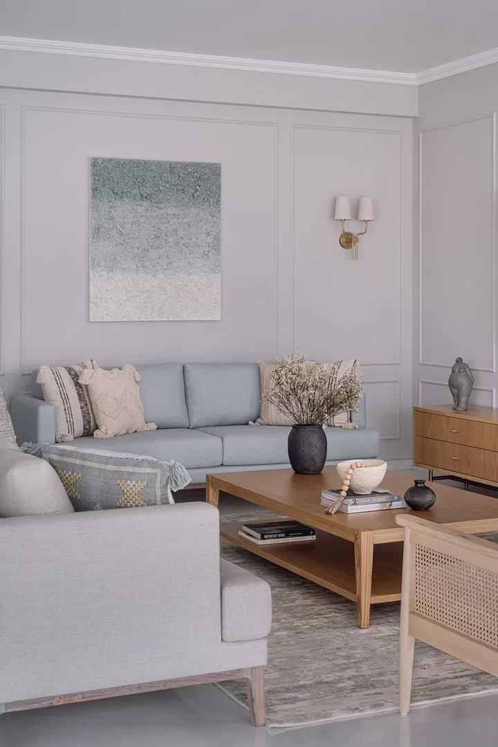 Sofa sets and two classic Chandigarh chairs in the living room of Disha Bhavsar and Shivani Ajmera's 2-bedroom apartment in Parsi, Mumbai.