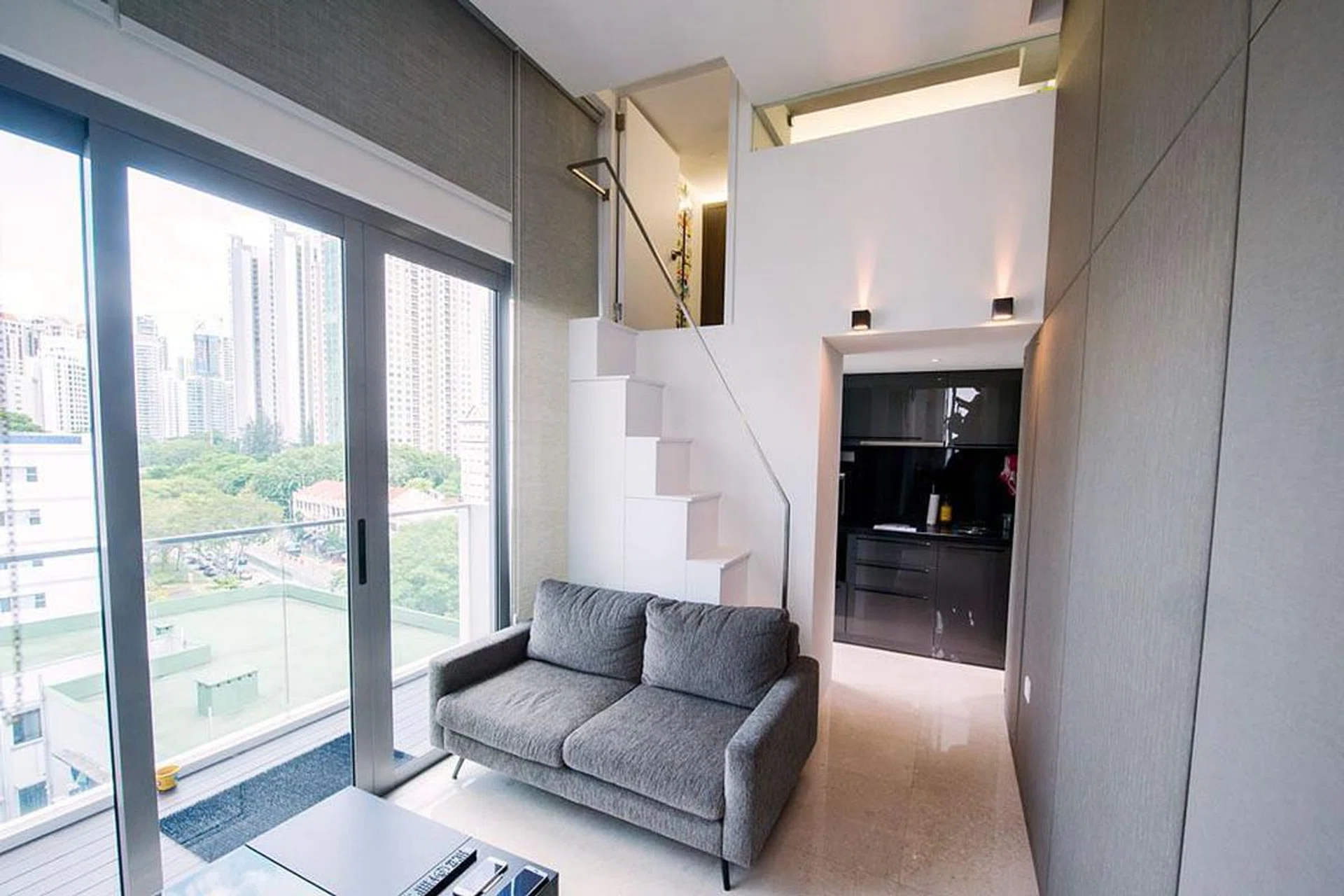 Living room in a family of 3's 840 sq ft mini condominium in River Valley, designed by interior designer Kelvin Bing.
