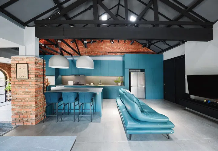The kitchen and living areas seamlessly designed to sit side-by-side in this 1,189 sq ft single-storey corner terrace house in Siglap.