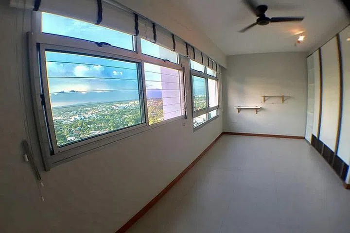 This 36th-floor unit in Holland Drive was sold for $1.03 million in July. The buyers are said to have been drawn to its "million-dollar view" of landed properties.