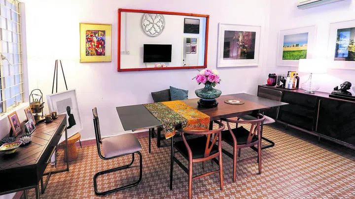 Retro dining room in this semi-detached house in Yio Chu Kang for an art gallery owner and his dogs.