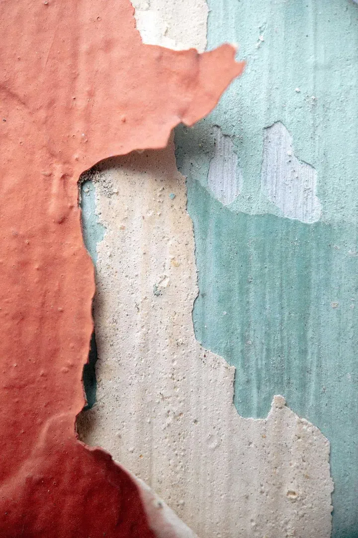 Peeling wallpaper from a wall