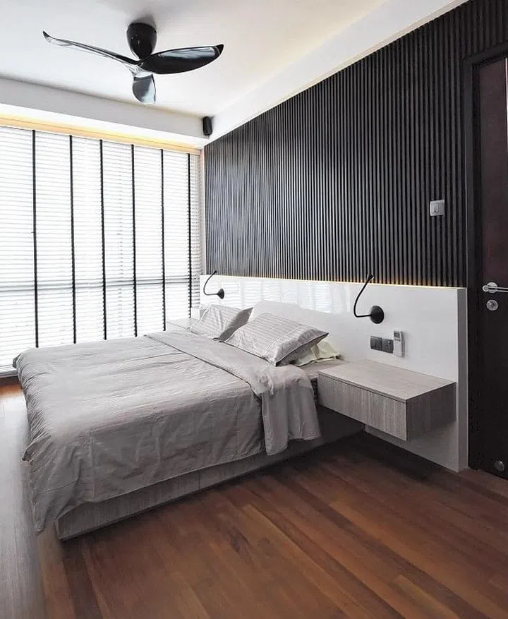 The master bedroom (above) in this Balestier 3-bedroom condominium and its reading-study corner, which is marked by a white frame.
