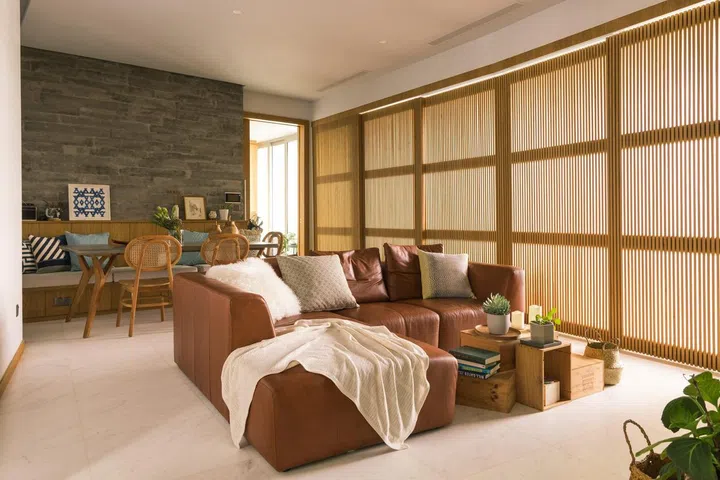 Living room in a 1,900 sq ft 3-bedroom condominium in Sentosa for a young couple and their two cats.