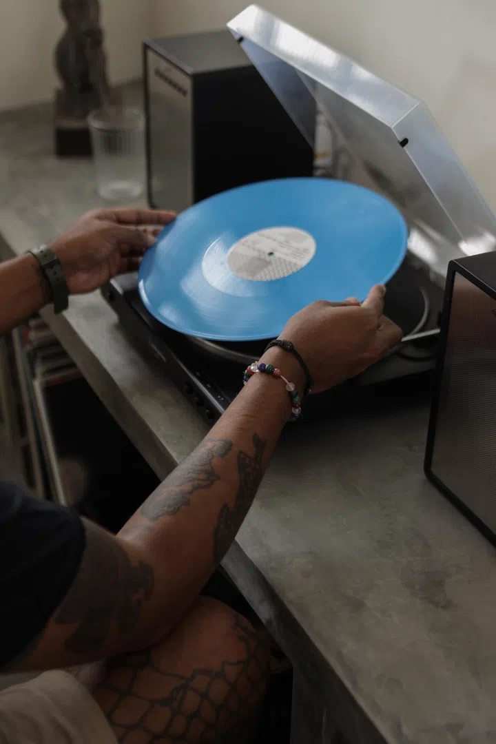 Homeowner reaches for a vinyl record.