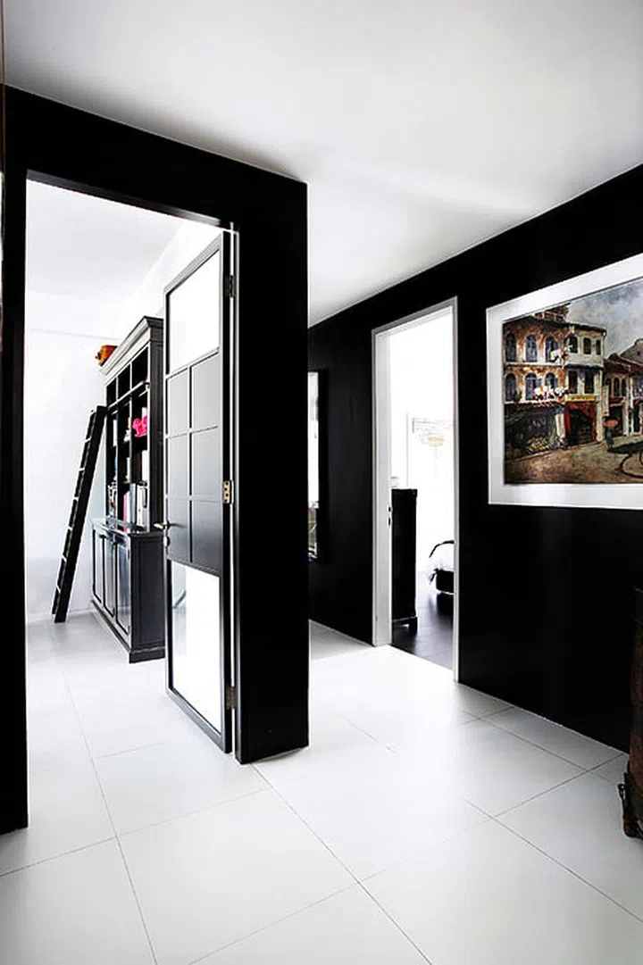 To balance the drama and darkness of the black walls, homeowner, Andrea, used a door with glass portions for the study.