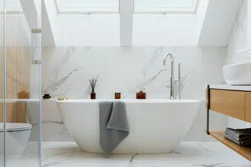 Stylish bathroom interior design with marble panels. 