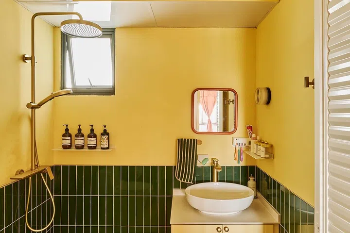 The common bathroom was one of several spaces left incomplete when the family moved in, requiring last-minute fixes after handover.