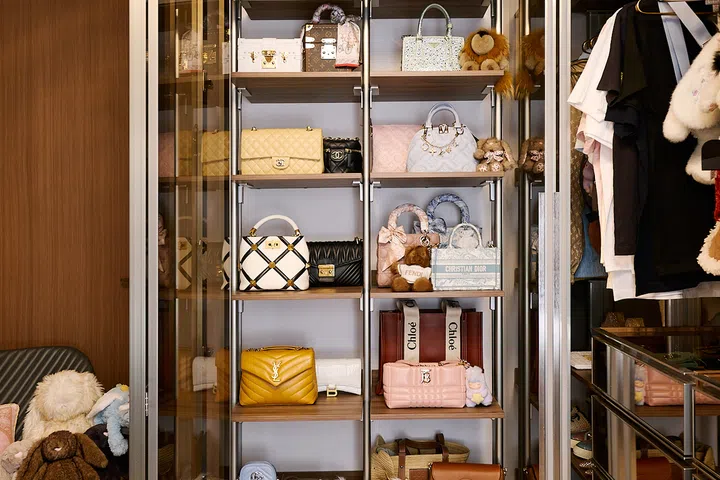 Charmaine’s bag collection turns one wall into a personal display.