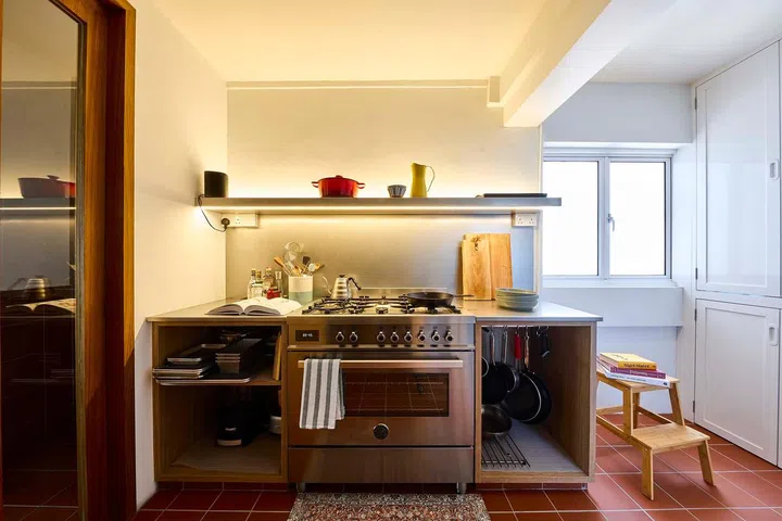 Open shelves are a practical solution for those with a pared-down collection of cooking tools and appliances.