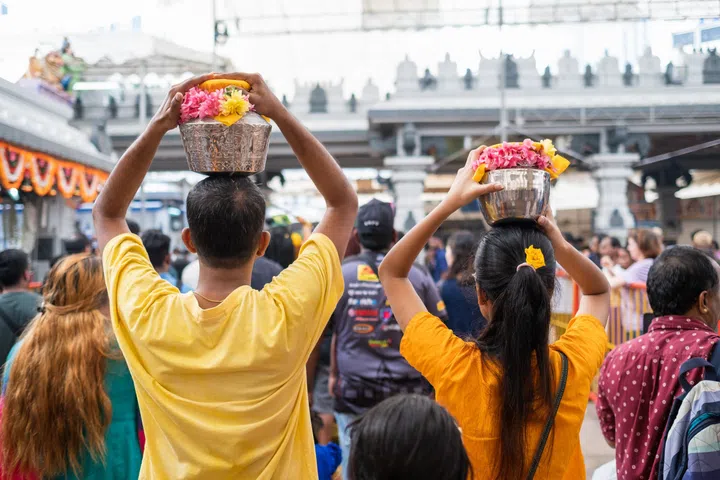SINGAPORE - Feb 08, 2020: Thaipusam is a religious celebration by devotees. Its highlight is a barefoot walk of devotees carrying milk pots and dancing with prickly kavadis.