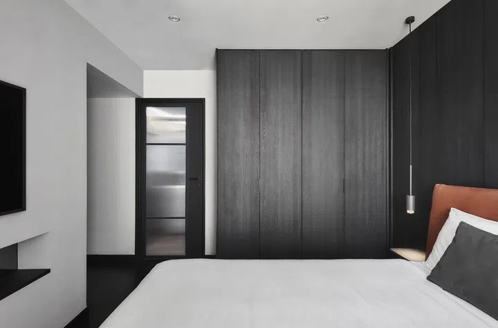All black and white master bedroom design in this 4-room Punggol HDB.