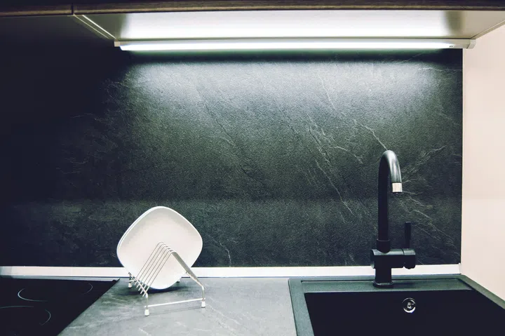 A modern kitchen showcases sleek design with minimalist elements.