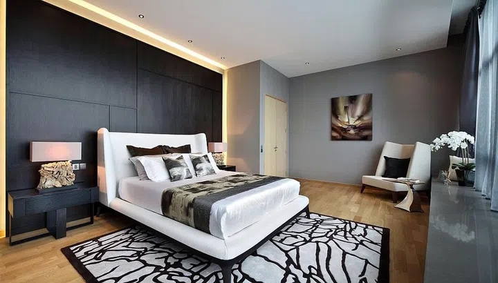 In the master bedroom, a simple but elegant feature panel behind the bed gives the space depth.