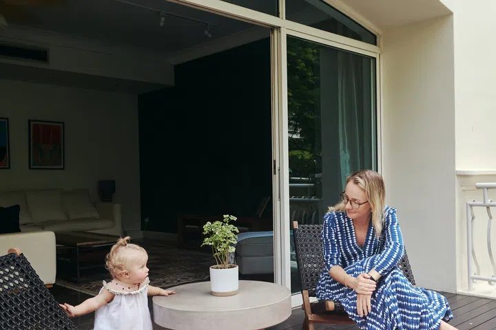 Lotte and her youngest daughter share a quiet moment out on the balcony.