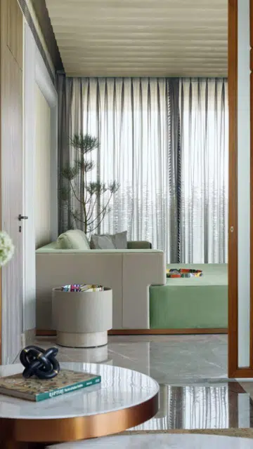 Tucked away in a corner is the family den, which can be closed off to create a private guest lounge.